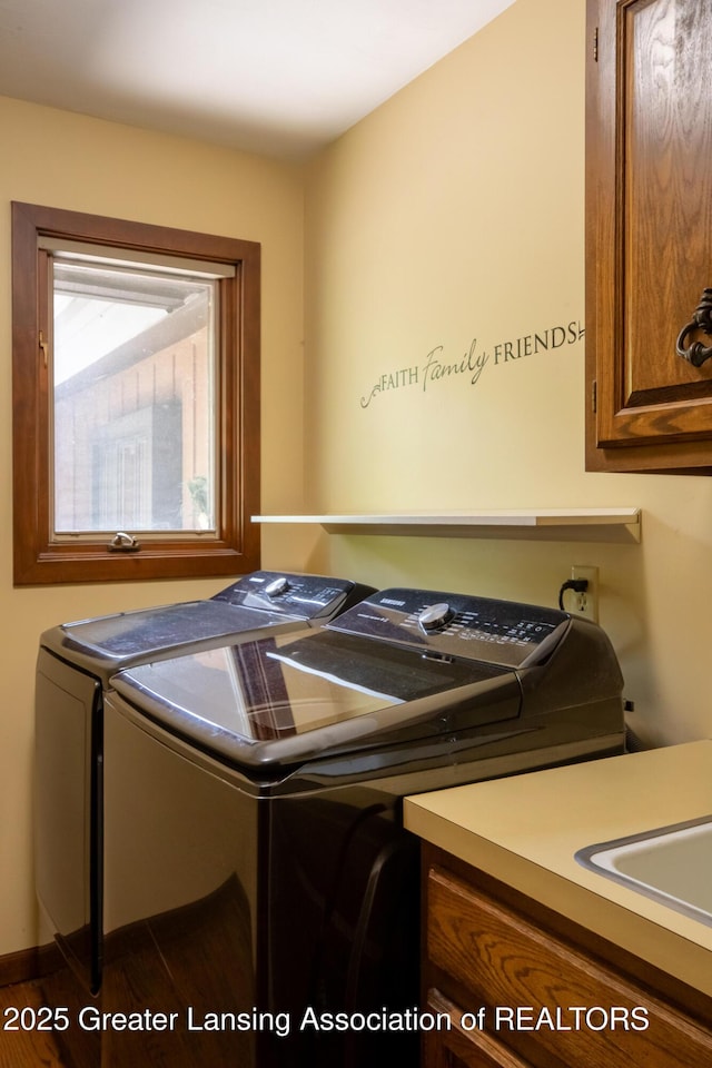 280 Winterberry Ln, Okemos, MI 48864 - laundry room featuring washing machine and clothes dryer and cabinet space