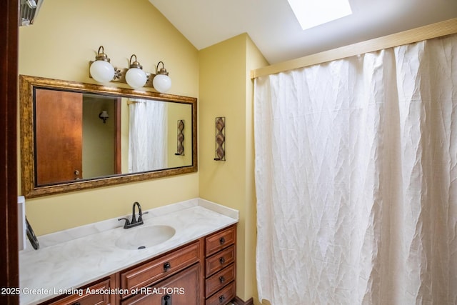 280 Winterberry Ln, Okemos, MI 48864 - full bath with vanity, a skylight, vaulted ceiling, and a shower with shower curtain