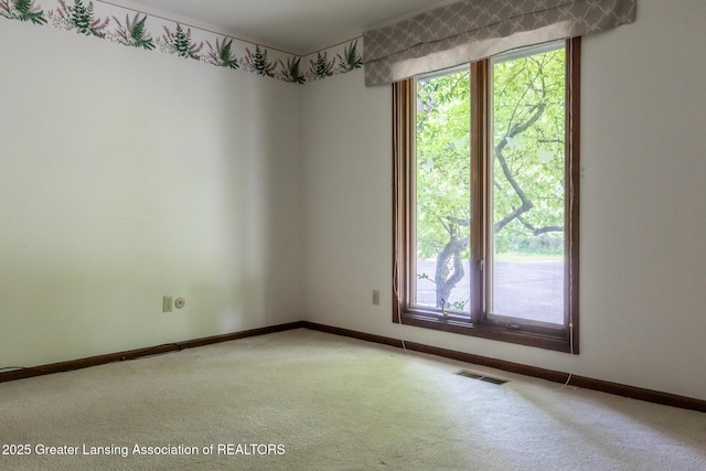 280 Winterberry Ln, Okemos, MI 48864 - carpeted spare room featuring baseboards
