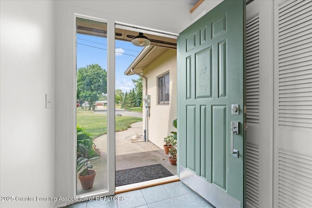 10138 Baron Blvd, Dimondale, MI 48821 - entryway with tile patterned floors