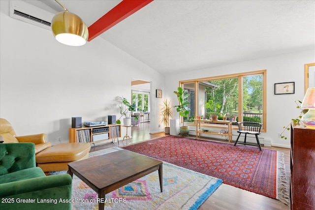 10138 Baron Blvd, Dimondale, MI 48821 - living area featuring a wall mounted air conditioner, wood finished floors, and a baseboard heating unit