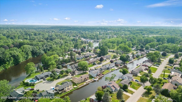 10138 Baron Blvd, Dimondale, MI 48821 - aerial view of property and surrounding area featuring a forest and nearby suburban area