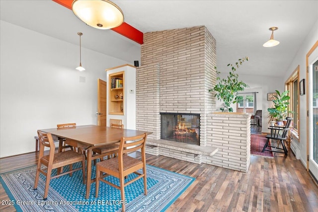 10138 Baron Blvd, Dimondale, MI 48821 - dining room featuring wood finished floors and a fireplace