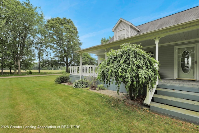 14235 Saxton Rd, Springport, MI 49284 - view of exterior entry featuring covered porch and a lawn