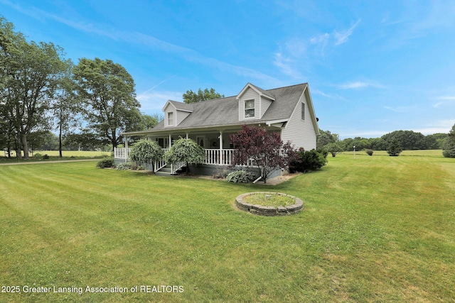 14235 Saxton Rd, Springport, MI 49284 - view of front of house featuring covered porch and a front lawn