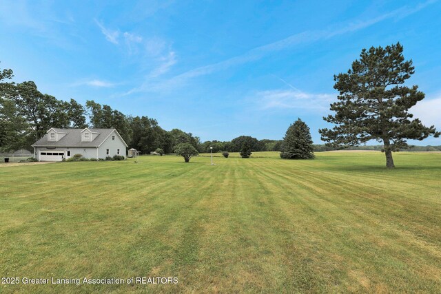 14235 Saxton Rd, Springport, MI 49284 - view of grassy yard featuring a garage