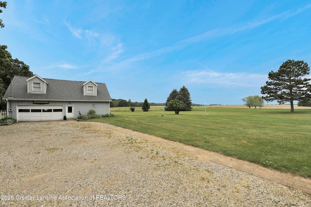 14235 Saxton Rd, Springport, MI 49284 - view of side of home featuring dirt driveway, a yard, and roof with shingles