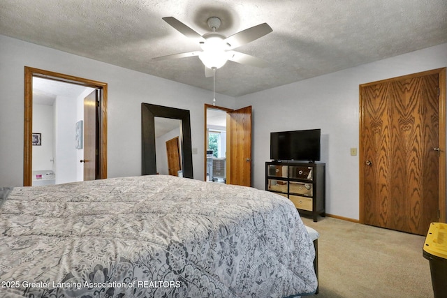 14235 Saxton Rd, Springport, MI 49284 - bedroom with light carpet, a textured ceiling, and ceiling fan