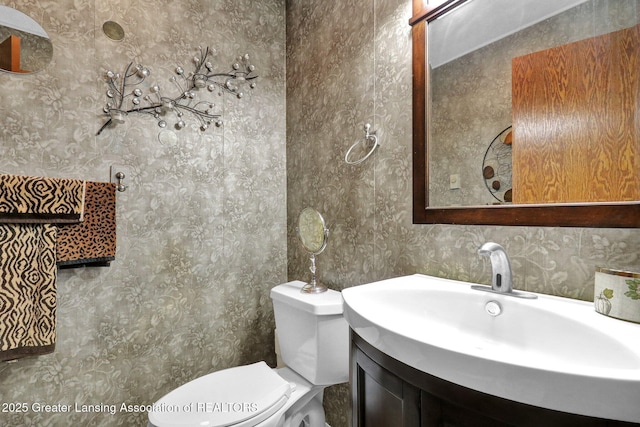 14235 Saxton Rd, Springport, MI 49284 - bathroom with vanity and wallpapered walls