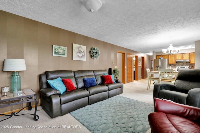 14235 Saxton Rd, Springport, MI 49284 - living room featuring light colored carpet, a chandelier, and a textured ceiling