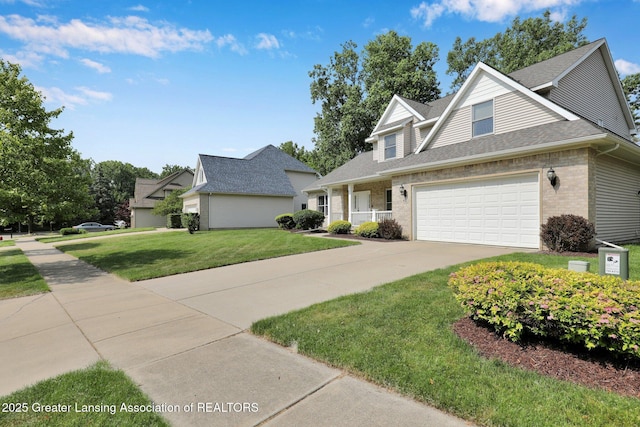 1823 Cricket Ln, East Lansing, MI 48823 - traditional home with a front yard, brick siding, driveway, an attached garage, and a shingled roof