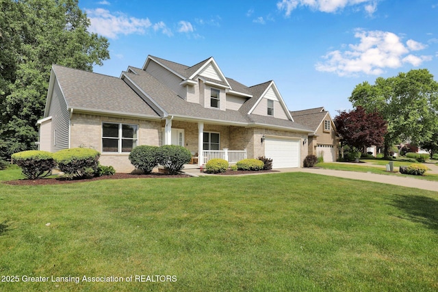 1823 Cricket Ln, East Lansing, MI 48823 - view of front of home with a porch, brick siding, a front yard, and driveway