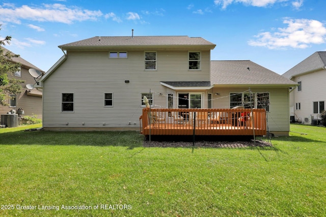 1823 Cricket Ln, East Lansing, MI 48823 - back of house with a deck and a lawn