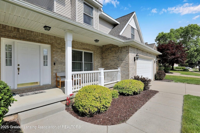 1823 Cricket Ln, East Lansing, MI 48823 - doorway to property with a porch, a garage, brick siding, and a shingled roof
