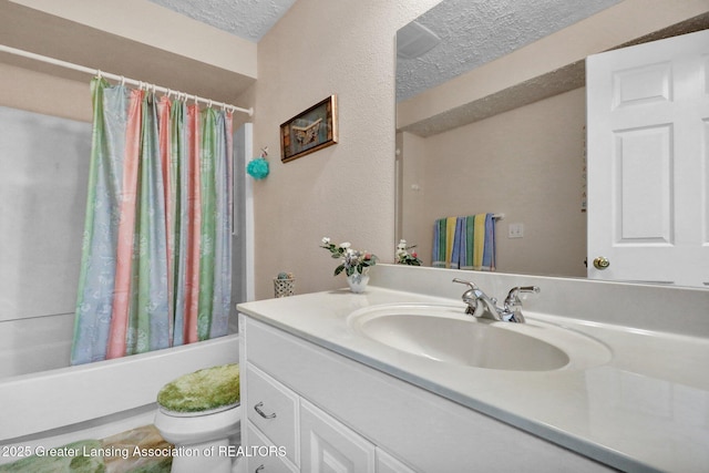 1823 Cricket Ln, East Lansing, MI 48823 - bathroom with vanity, shower / bath combination with curtain, and a textured ceiling
