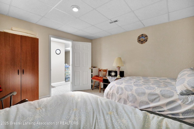 1823 Cricket Ln, East Lansing, MI 48823 - bedroom with a drop ceiling and carpet flooring