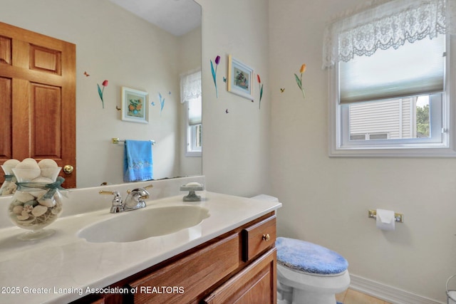 1823 Cricket Ln, East Lansing, MI 48823 - bathroom featuring toilet and vanity
