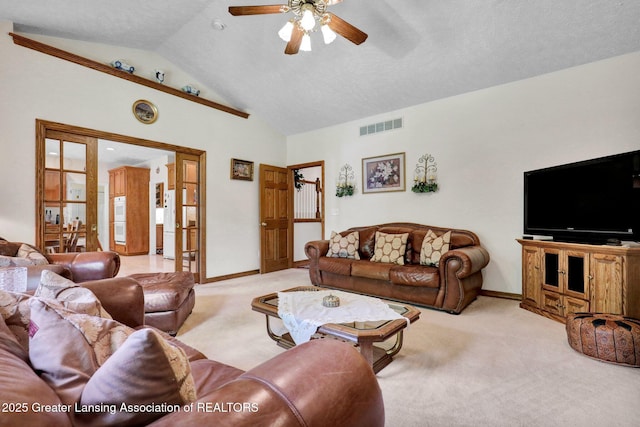 1823 Cricket Ln, East Lansing, MI 48823 - living area with light carpet, ceiling fan, and vaulted ceiling