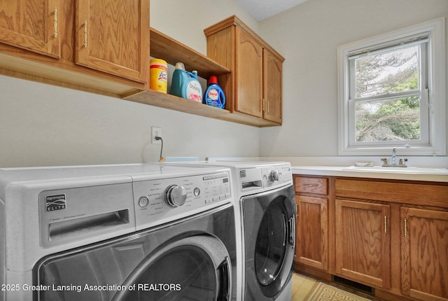1823 Cricket Ln, East Lansing, MI 48823 - washroom featuring washing machine and clothes dryer and cabinet space