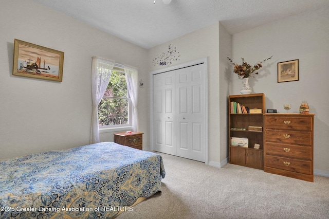 1823 Cricket Ln, East Lansing, MI 48823 - carpeted bedroom featuring a closet and baseboards