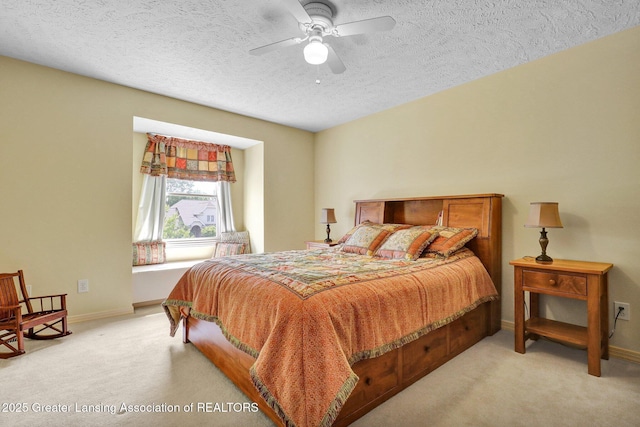 1823 Cricket Ln, East Lansing, MI 48823 - bedroom with light colored carpet, a textured ceiling, and a ceiling fan