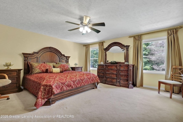 1823 Cricket Ln, East Lansing, MI 48823 - bedroom featuring carpet, a textured ceiling, and a ceiling fan