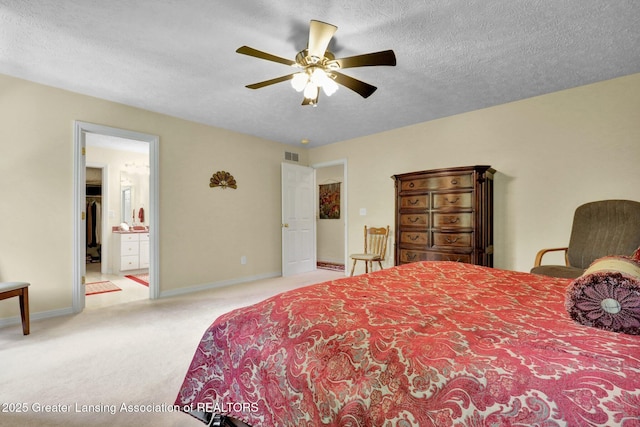 1823 Cricket Ln, East Lansing, MI 48823 - bedroom with carpet floors, a textured ceiling, ensuite bath, and ceiling fan