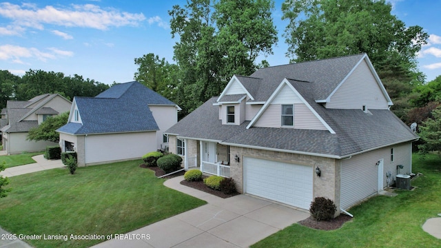 1823 Cricket Ln, East Lansing, MI 48823 - traditional-style house featuring concrete driveway, roof with shingles, a front yard, and brick siding