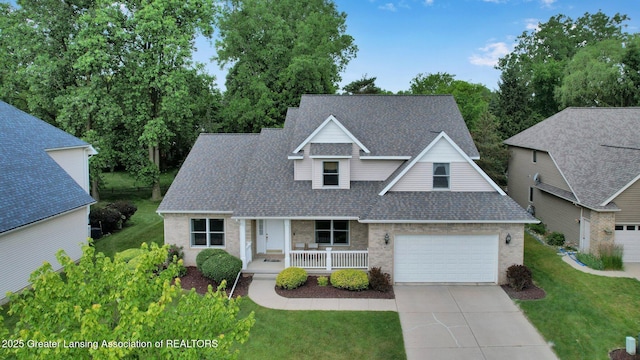 1823 Cricket Ln, East Lansing, MI 48823 - traditional-style house with a shingled roof, a porch, driveway, a front lawn, and brick siding