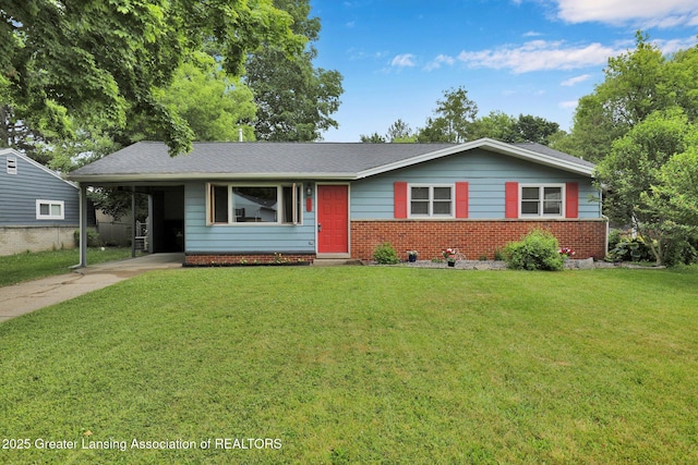 528 Thomas L Pkwy, Lansing, MI 48917 - ranch-style house featuring concrete driveway, a front lawn, brick siding, and an attached carport