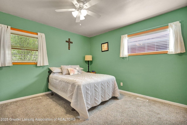 528 Thomas L Pkwy, Lansing, MI 48917 - carpeted bedroom with baseboards and ceiling fan