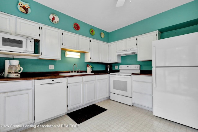 528 Thomas L Pkwy, Lansing, MI 48917 - kitchen featuring white appliances, under cabinet range hood, dark countertops, white cabinetry, and light flooring