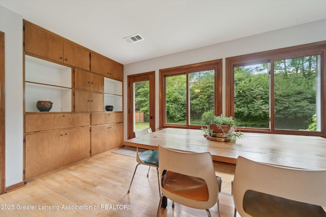 2391 Shawnee Trl, Okemos, MI 48864 - dining space with light wood-style flooring