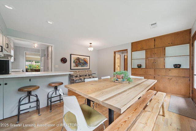 2391 Shawnee Trl, Okemos, MI 48864 - dining area with light wood-style flooring