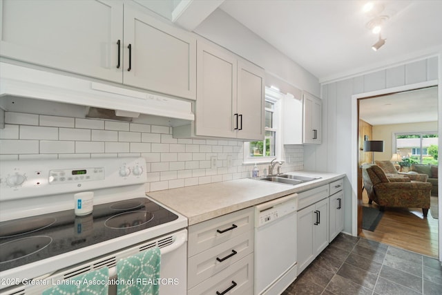 2391 Shawnee Trl, Okemos, MI 48864 - kitchen featuring white appliances, backsplash, light countertops, white cabinets, and under cabinet range hood
