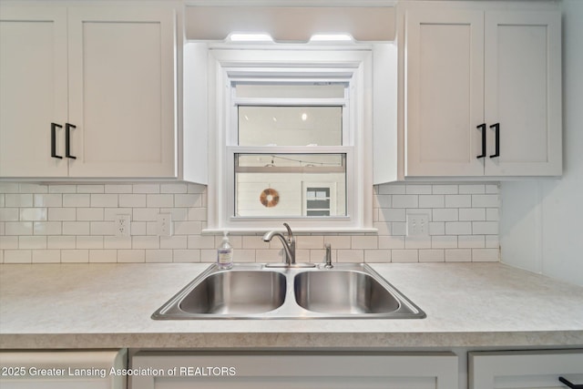2391 Shawnee Trl, Okemos, MI 48864 - kitchen featuring light countertops and decorative backsplash