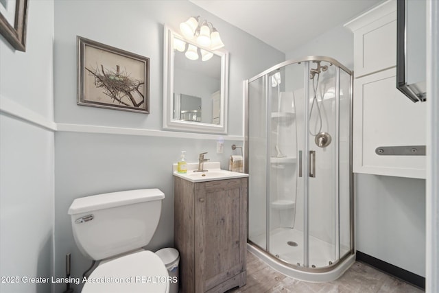 2391 Shawnee Trl, Okemos, MI 48864 - full bath with vanity, a shower stall, and wood finished floors