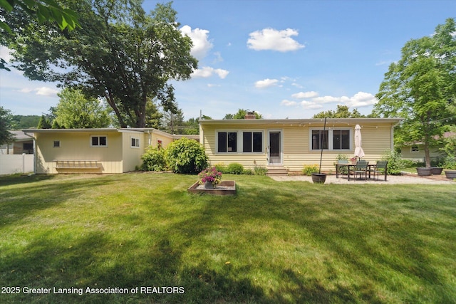 2391 Shawnee Trl, Okemos, MI 48864 - back of property with entry steps, a chimney, and a patio