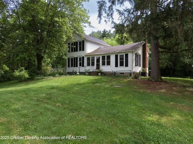 6631 Springport Rd, Jackson, MI 49201 - back of property with a shingled roof