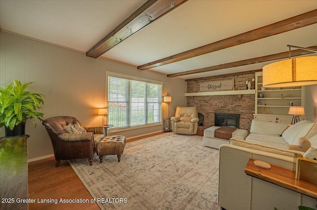 2300 Hampshire Rd, Lansing, MI 48911 - living room featuring wood finished floors and beamed ceiling