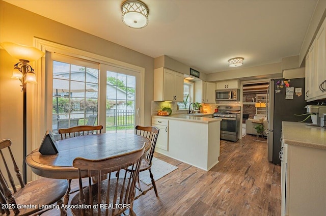 2300 Hampshire Rd, Lansing, MI 48911 - dining room with dark wood-style floors