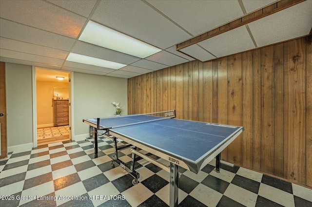 2300 Hampshire Rd, Lansing, MI 48911 - game room with tile patterned floors, wood walls, and a paneled ceiling