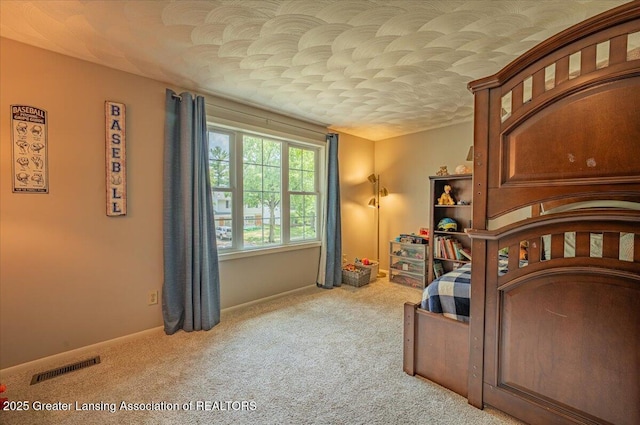 2300 Hampshire Rd, Lansing, MI 48911 - carpeted bedroom with baseboards