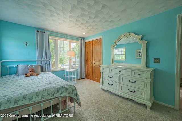 2300 Hampshire Rd, Lansing, MI 48911 - bedroom featuring light colored carpet and a closet