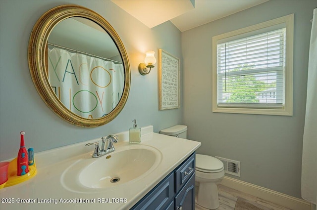 2300 Hampshire Rd, Lansing, MI 48911 - bathroom featuring vanity and wood finished floors