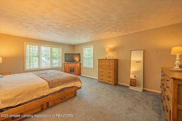 2300 Hampshire Rd, Lansing, MI 48911 - carpeted bedroom featuring baseboards