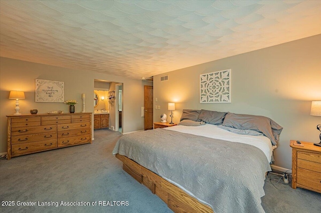 2300 Hampshire Rd, Lansing, MI 48911 - carpeted bedroom with baseboards and connected bathroom