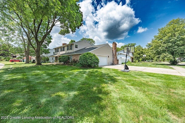 2300 Hampshire Rd, Lansing, MI 48911 - view of property exterior with driveway, a garage, a chimney, and a yard