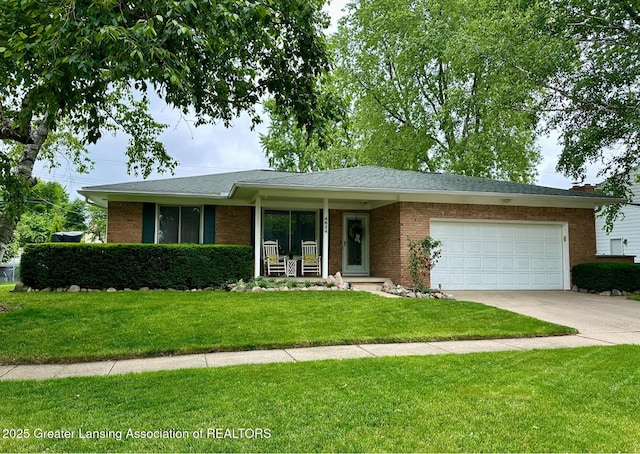 4624 Meaford St, Lansing, MI 48917 - ranch-style home with an attached garage, concrete driveway, a front yard, brick siding, and a porch