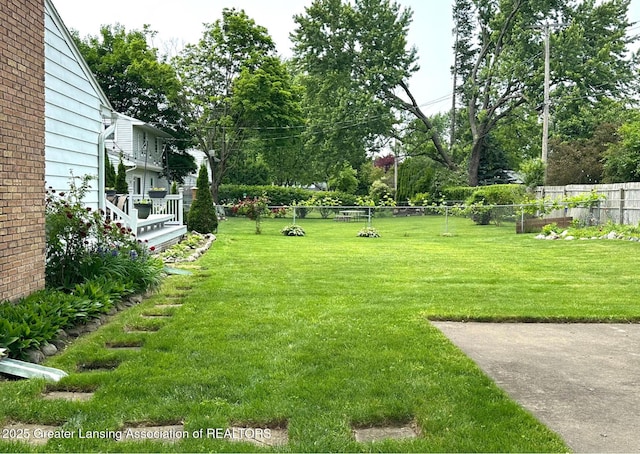 4624 Meaford St, Lansing, MI 48917 - view of yard with view of wooded area